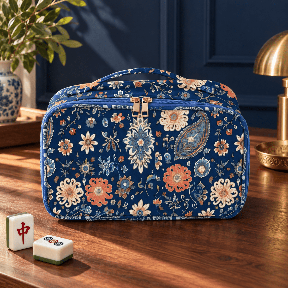 Blue bohemian floral Mahjong bag with zippered storage on a walnut tabletop