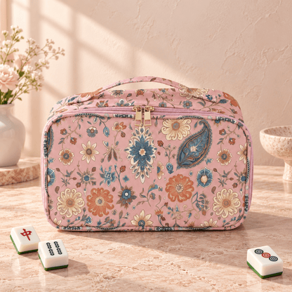 Pink bohemian floral Mahjong bag with zippered storage on a blush stone tabletop