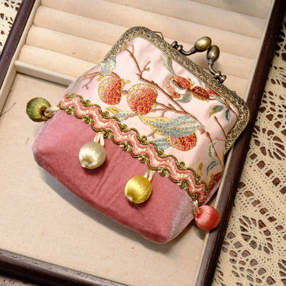 Lychee pink vintage coin purse with fruit embroidery, brass clasp, and hanging fabric beads.