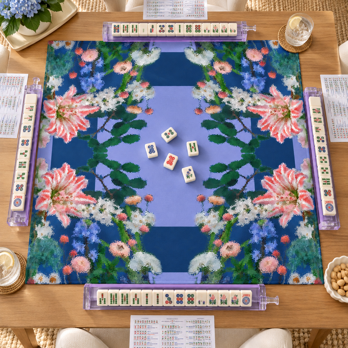 Overhead view of the Lily Garden Mahjong Mat with mahjong tiles and racks on a wooden table.
