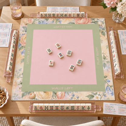Overhead view of the Pastel Bloom Mahjong Mat with mahjong tiles and racks on a wooden table.