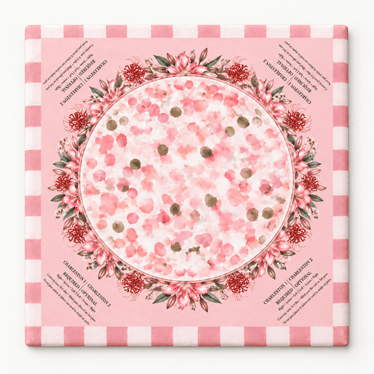 Square pink mahjong mat with a circular floral wreath, scattered blossoms, and a pink checkered border, displayed against white.